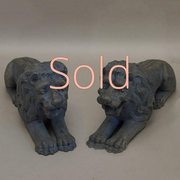 Pair of Carved Lions Couchant